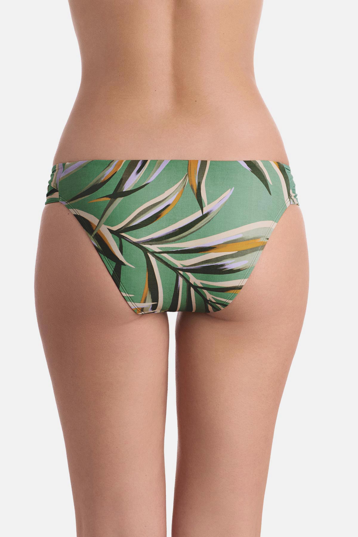Back view of multicolored leaf printed swim bottoms with side cutouts 