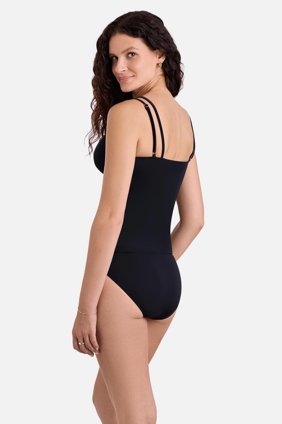 Woman turned left wearing a black tankini top with matching swim bottoms